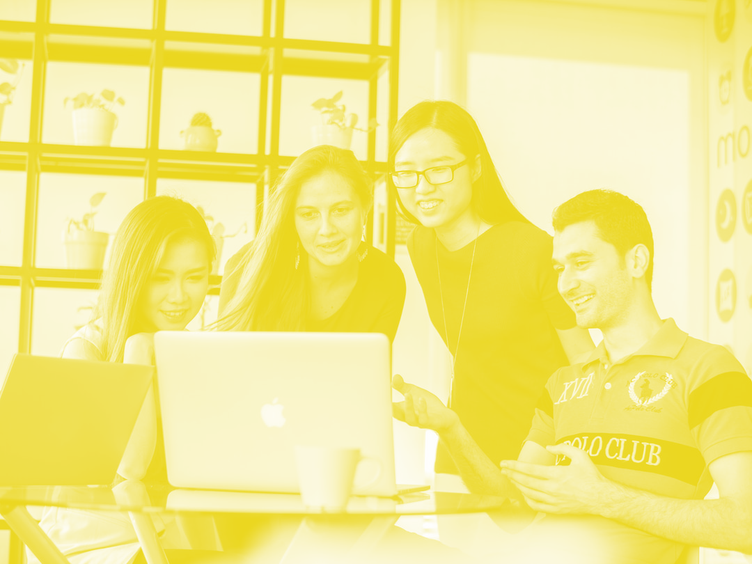Group Looking At a Laptop